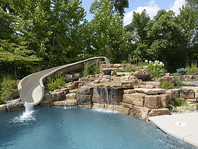 waterfall and waterslide lend serenity to this relaxing refuge