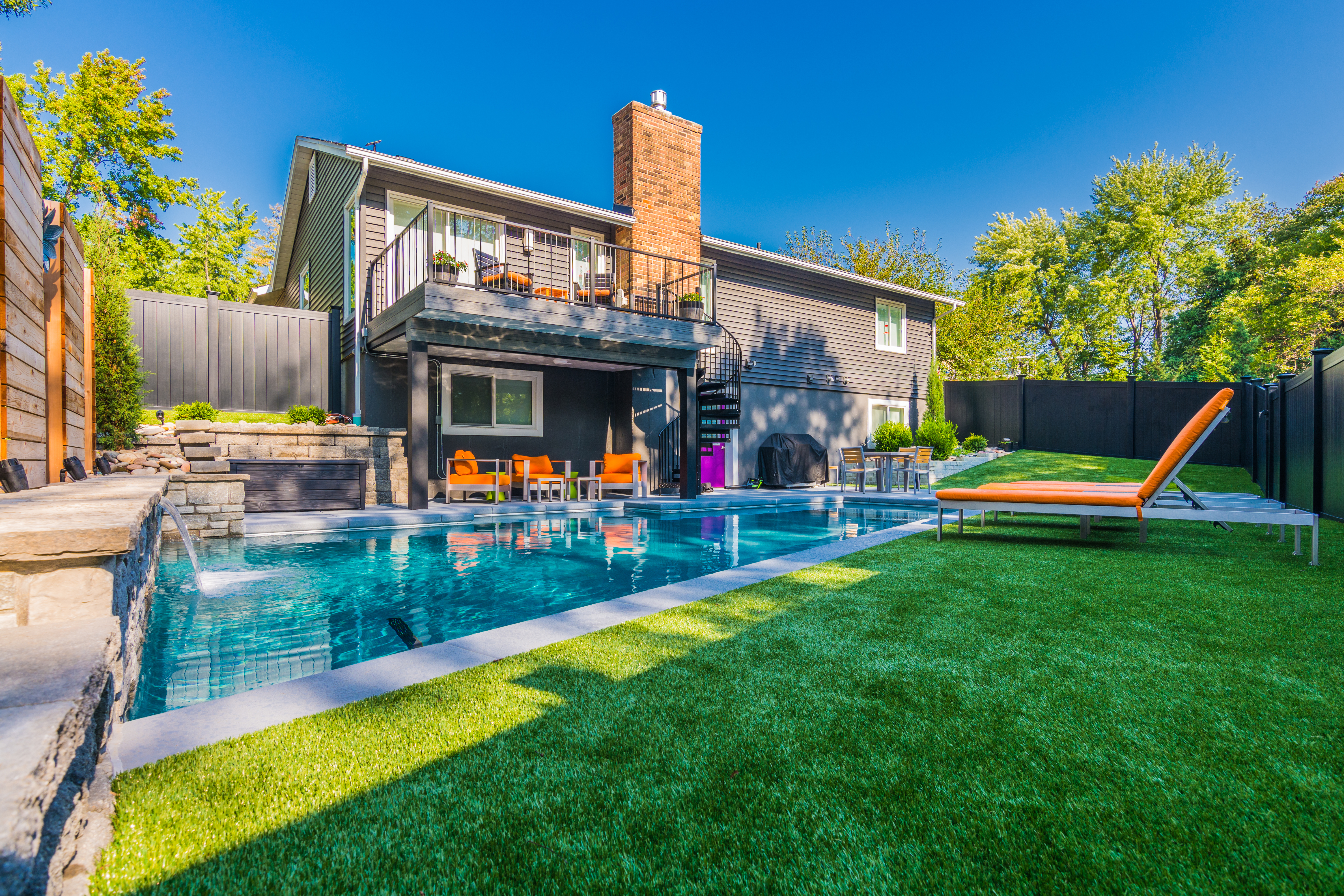 Pool in background with synthetic turf