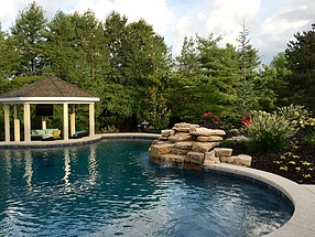 beautifully lanscaped garden areas surrounding pool and waterside gazebo