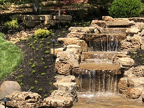 landscape design, hardscape, st. louis landscape, pondless waterfall, limestone boulders, sedum, ground cover