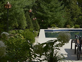 landscape design, lighting, st. louis landscape, bronze, tiki torch, pool