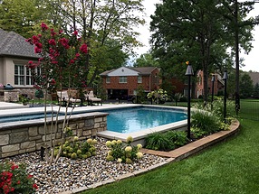 landscape design, lighting, st. louis landscape, copper, tiki torches, hydrangea, crape myrtle, colorful, pool