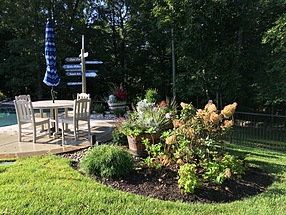 landscape design, hardscape, st. louis landscape, flowers, colorful, barrel, pots, pool